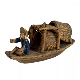 Ceramic Figure In the Bow of a Boat