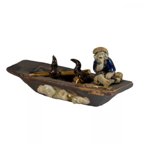 Ceramic Figure In a Boat with a Cormorant